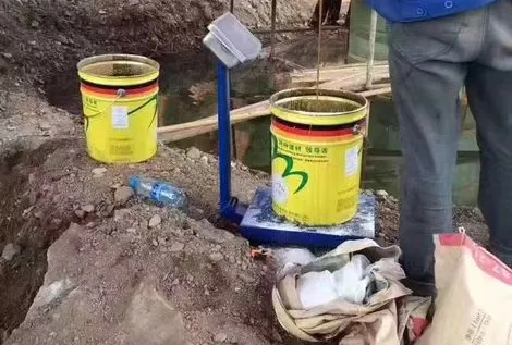 Coastal bridge pier underwater epoxy grout mixing for fiberglass sleeve repair